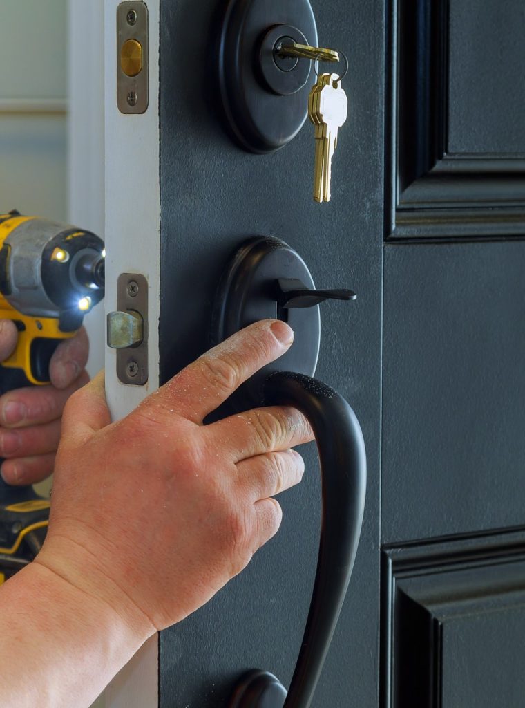 closeup-of-a-professional-locksmith-installing-a-new-lock-on-a-house-exterior-door-with-the-inside.jpg closeup-of-a-professional-locksmith-installing-a-new-lock-on-a-house-exterior-door-with-the-inside.jpg